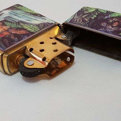 An awesome "Mysteries of the Forest" Jaguar & Cub at Turtle Falls ZIPPO lighter in its tin