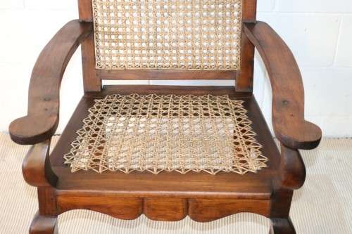A lovely rattan-back and seat arm chair with ball and claw feet & cabriole legs - great for a patio!