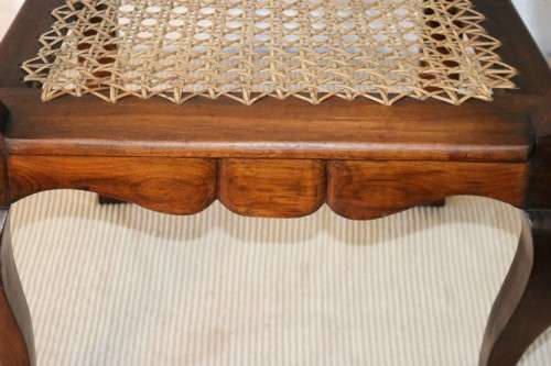 A lovely rattan-back and seat arm chair with ball and claw feet & cabriole legs - great for a patio!