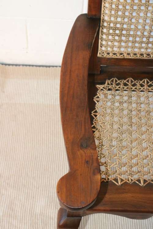 A lovely rattan-back and seat arm chair with ball and claw feet & cabriole legs - great for a patio!