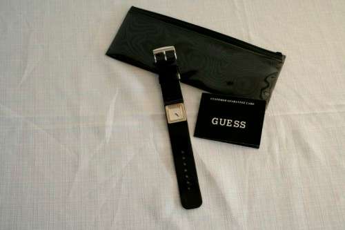 A fabulous original Guess ladies quartz wrist watch in its original pouch w/ purchase guarantee card