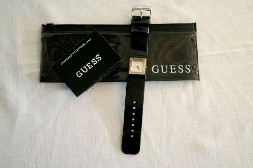 A fabulous original Guess ladies quartz wrist watch in its original pouch w/ purchase guarantee card