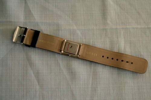 A fabulous original Guess ladies quartz wrist watch in its original pouch w/ purchase guarantee card