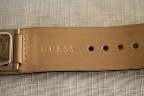 A fabulous original Guess ladies quartz wrist watch in its original pouch w/ purchase guarantee card