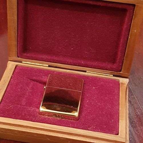 A superbly rare one-of-a-kind limited edition 18ct solid gold Zippo lighter in its custom walnut box