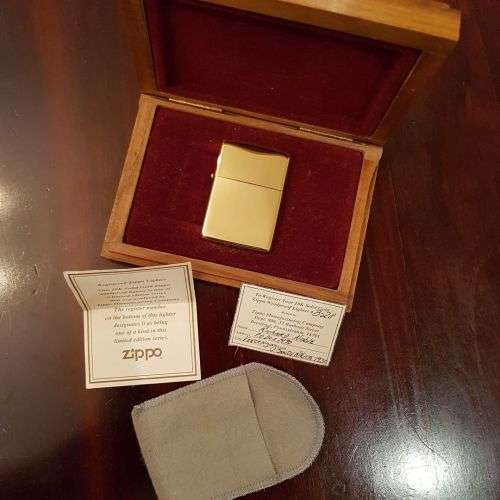 A superbly rare one-of-a-kind limited edition 18ct solid gold Zippo lighter in its custom walnut box