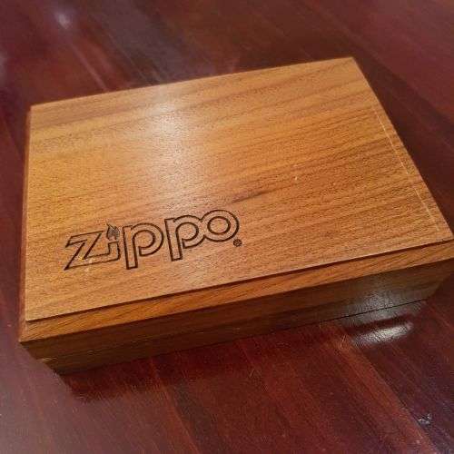 A superbly rare one-of-a-kind limited edition 18ct solid gold Zippo lighter in its custom walnut box
