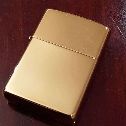 A superbly rare one-of-a-kind limited edition 18ct solid gold Zippo lighter in its custom walnut box