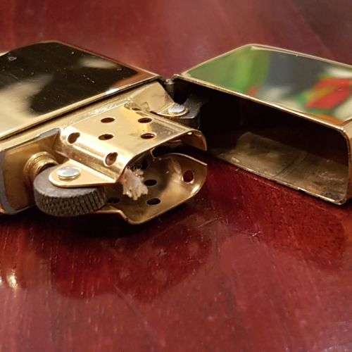 A superbly rare one-of-a-kind limited edition 18ct solid gold Zippo lighter in its custom walnut box