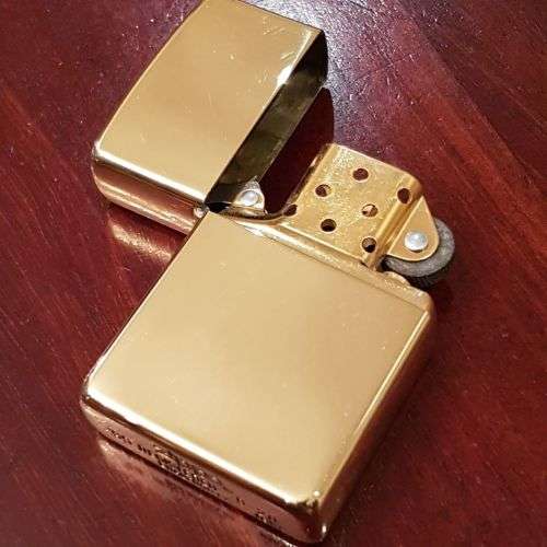 A superbly rare one-of-a-kind limited edition 18ct solid gold Zippo lighter in its custom walnut box