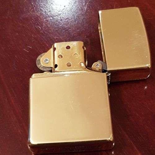 A superbly rare one-of-a-kind limited edition 18ct solid gold Zippo lighter in its custom walnut box