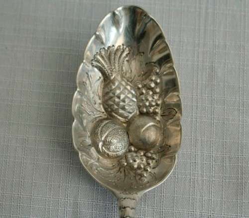 A spectacularly rare ornate pair of antique Victorian hallmarked Theodor Cohn sterling silver spoons