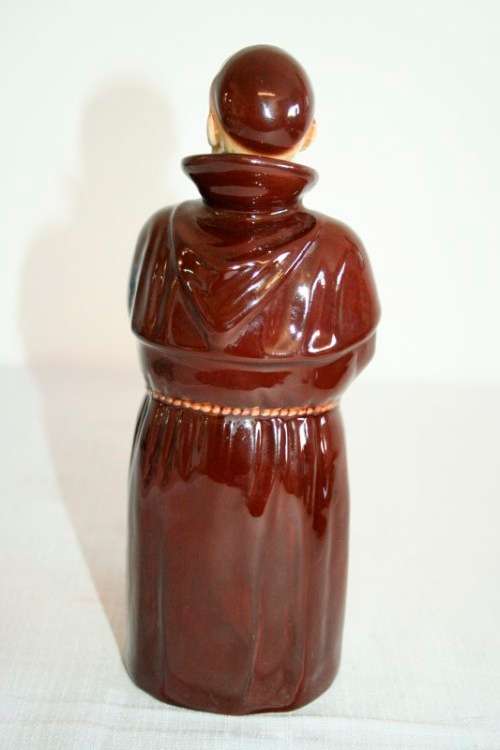 An awesome vintage Beswick Heatmaster Monk decanter with three cups on a porcelain serving plate