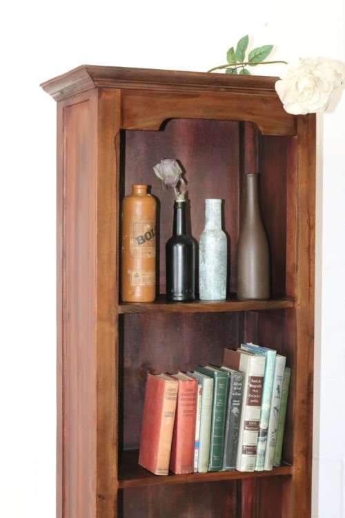 An incredible tall wooden bookcase with three spacious shelves and a bottom drawer - stunning!!