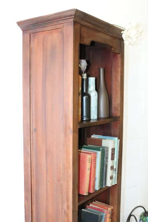 An incredible tall wooden bookcase with three spacious shelves and a bottom drawer - stunning!!