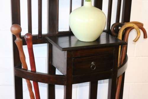 A wonderful tall hall stand with three mirrors, storage drawer and space for umbrellas/ canes