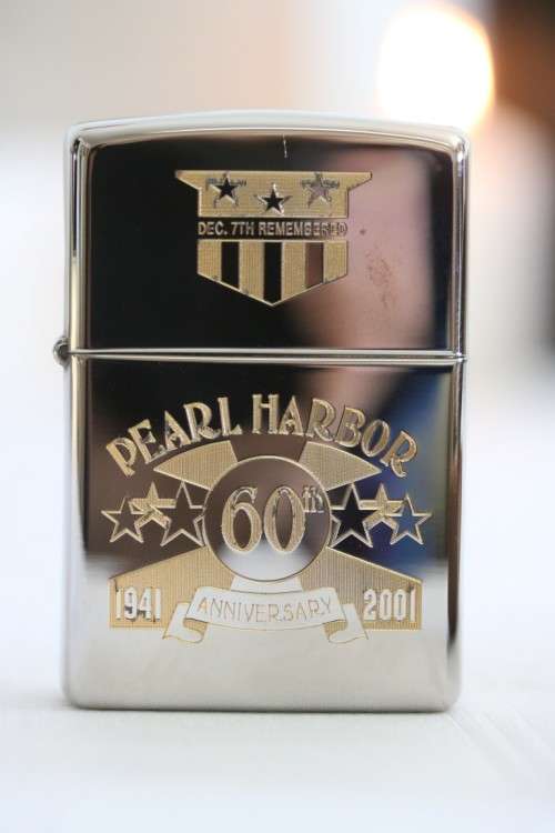 A RARE original "Pearl Harbor 60th Anniversary" silver plated  Zippo  - unused and in a box