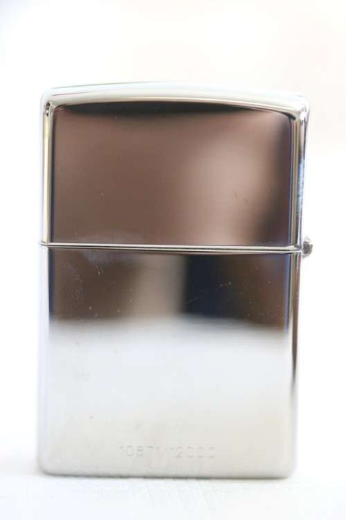 A RARE original "Pearl Harbor 60th Anniversary" silver plated  Zippo  - unused and in a box