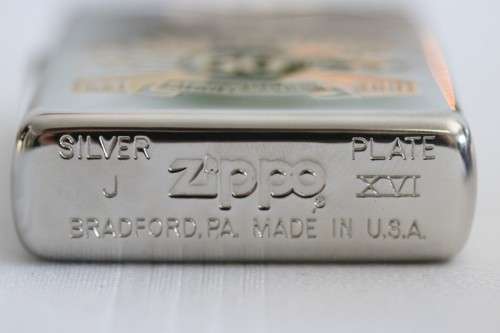 A RARE original "Pearl Harbor 60th Anniversary" silver plated  Zippo  - unused and in a box