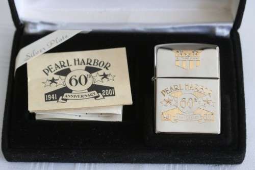 A RARE original "Pearl Harbor 60th Anniversary" silver plated  Zippo  - unused and in a box