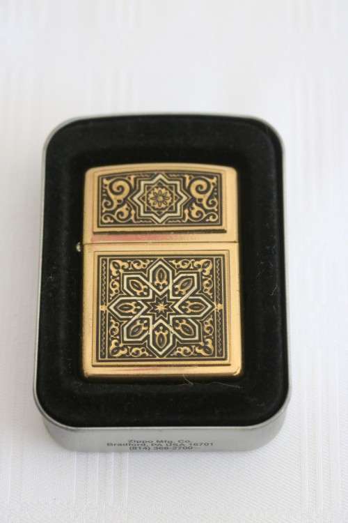 In incredible original Zippo with an amazing intricate design and a Brass finish in the original box