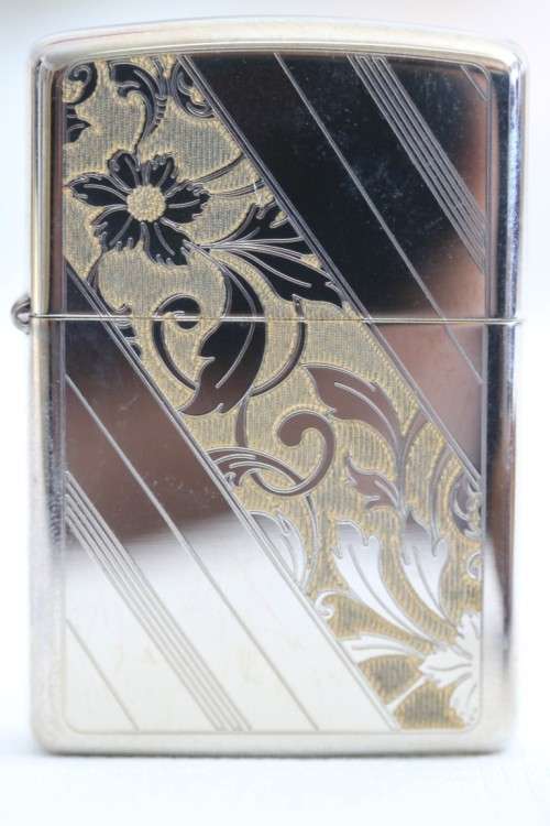 An original silver plated Zippo "limited edition" floral etched design lighter in its box