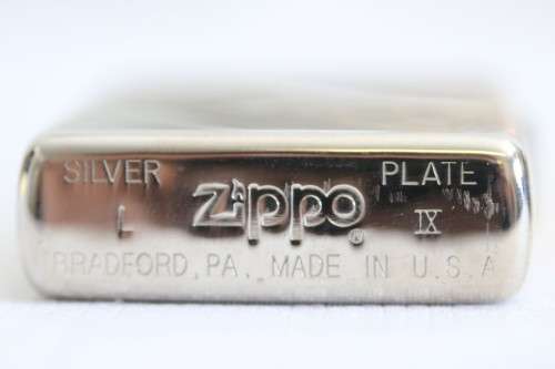 An original silver plated Zippo "limited edition" floral etched design lighter in its box