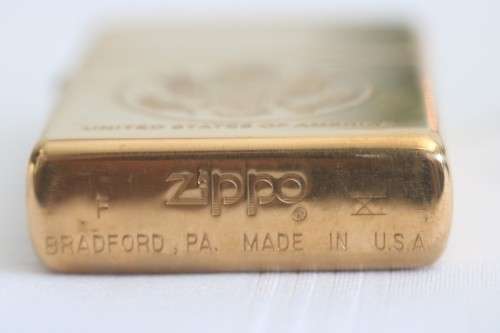 A wonderful original Gold tone Zippo "United States of America" lighter in the original box