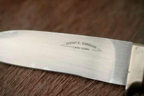 A beautifully custom hand-made original "Brent E Sandow" hunter knife in its original leather sheath