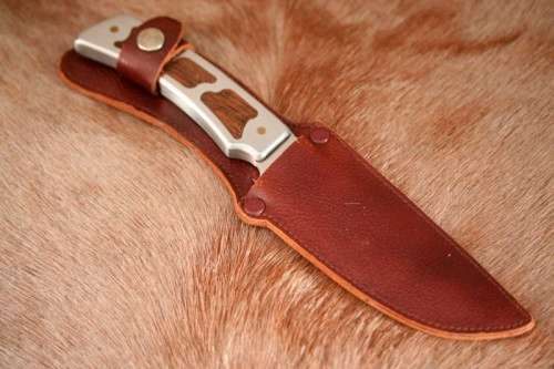 **RS17** A fantastic "surgical steel" Torro Model AS1004 Hunter knife in its original leather sheath
