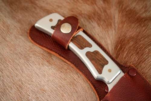**RS17** A fantastic "surgical steel" Torro Model AS1004 Hunter knife in its original leather sheath