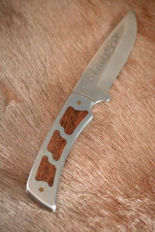 **RS17** A fantastic "surgical steel" Torro Model AS1004 Hunter knife in its original leather sheath