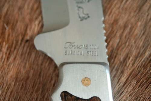**RS17** A fantastic "surgical steel" Torro Model AS1004 Hunter knife in its original leather sheath