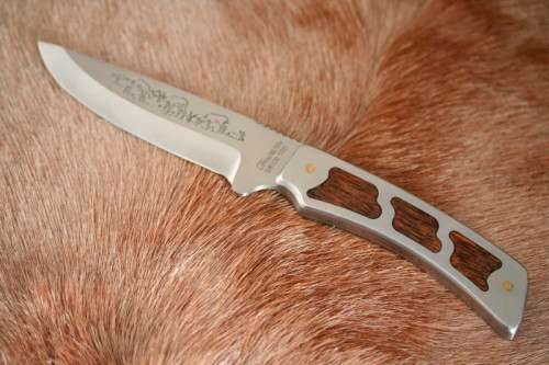 **RS17** A fantastic "surgical steel" Torro Model AS1004 Hunter knife in its original leather sheath