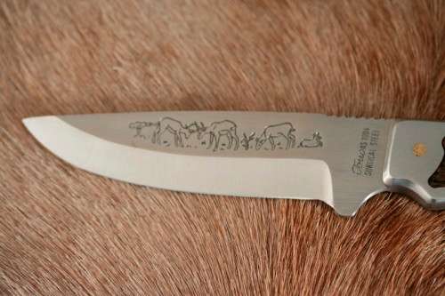 **RS17** A fantastic "surgical steel" Torro Model AS1004 Hunter knife in its original leather sheath