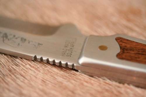 **RS17** A fantastic "surgical steel" Torro Model AS1004 Hunter knife in its original leather sheath
