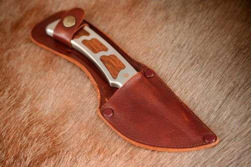 An awesome "surgical steel" Torro Model AS1003 "skinning" knife in its original leather sheath