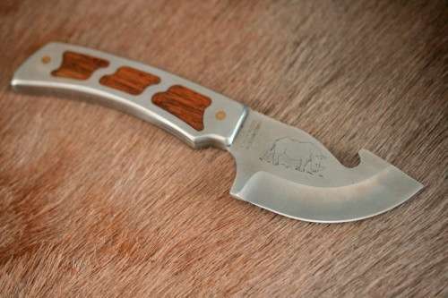An awesome "surgical steel" Torro Model AS1003 "skinning" knife in its original leather sheath