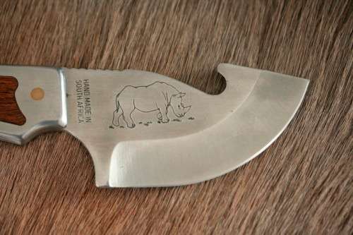 An awesome "surgical steel" Torro Model AS1003 "skinning" knife in its original leather sheath
