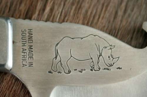 An awesome "surgical steel" Torro Model AS1003 "skinning" knife in its original leather sheath