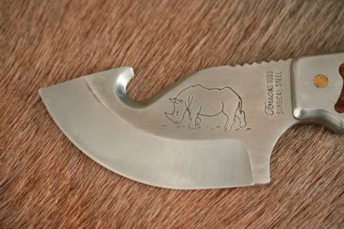 An awesome "surgical steel" Torro Model AS1003 "skinning" knife in its original leather sheath