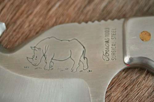 An awesome "surgical steel" Torro Model AS1003 "skinning" knife in its original leather sheath