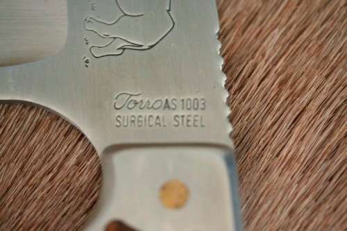 An awesome "surgical steel" Torro Model AS1003 "skinning" knife in its original leather sheath