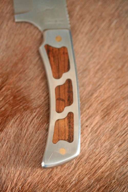 An awesome "surgical steel" Torro Model AS1003 "skinning" knife in its original leather sheath