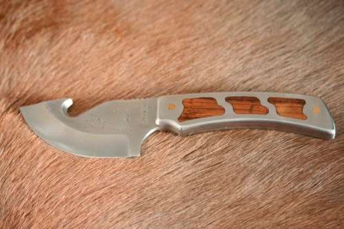 An awesome "surgical steel" Torro Model AS1003 "skinning" knife in its original leather sheath