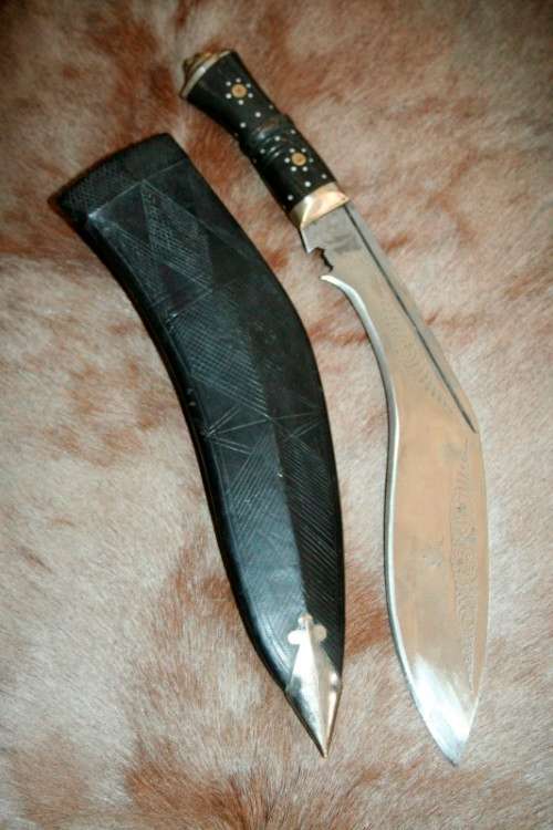 An incredible hand made authentic Nepalese "Kukri" (Gurkha) knife in its original leather sheath