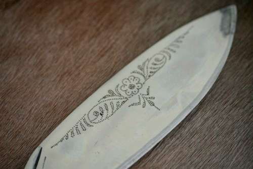 An incredible hand made authentic Nepalese "Kukri" (Gurkha) knife in its original leather sheath