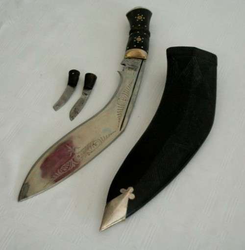 An incredible hand made authentic Nepalese "Kukri" (Gurkha) knife in its original leather sheath
