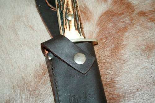 A superb original handmade German Solingen Inox Linder Bowie knife in its embossed leather scabbard