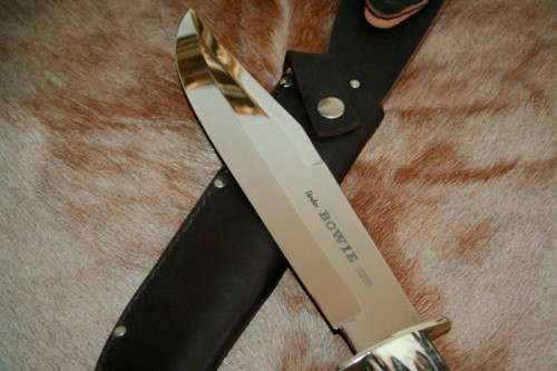 A superb original handmade German Solingen Inox Linder Bowie knife in its embossed leather scabbard